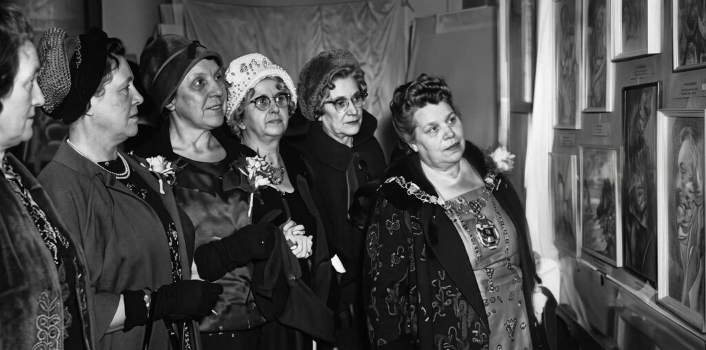 Admiring pictures on show in the 1962 Skerton Women's Evening Institute annual exhibition are art teacher Miss E. Baxendall, head teacher Miss M. Whittaker, chairman Mrs W Sweeney, Mrs A Wilson (chairman of the social committee), County Councillor Mrs A, Clayton, and the mayor of Lancaster, counsellor Mrs M.J. Lovett-Horn | Restored Photograph
